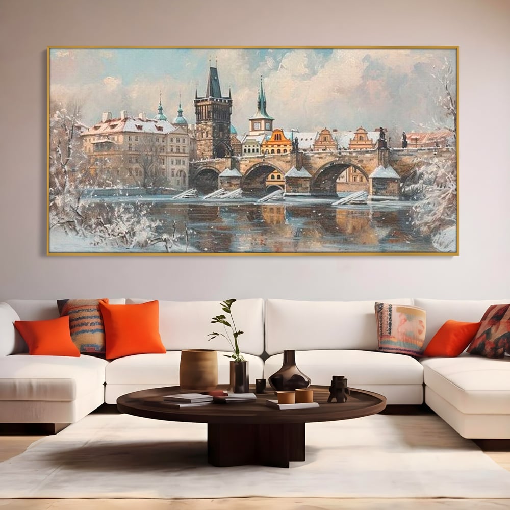 Tablou canvas cu pictura cu podul carol din praga iarna, in rama de aluminiu auriu, pe perete intr-un living